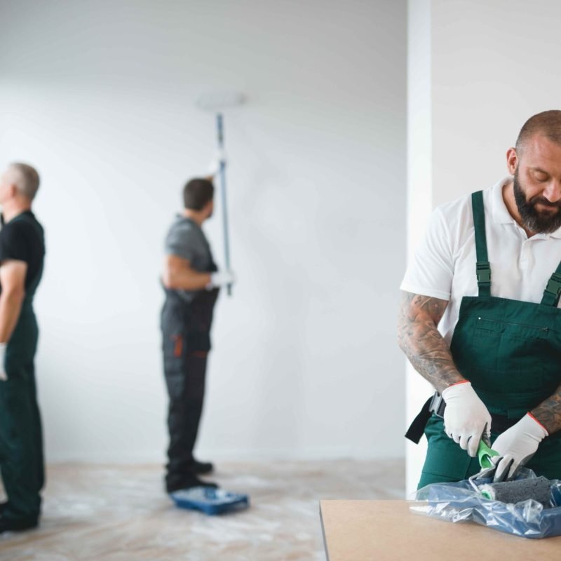 builder-preparing-to-paint-the-apartment-during-re-2023-11-27-05-29-26-utc