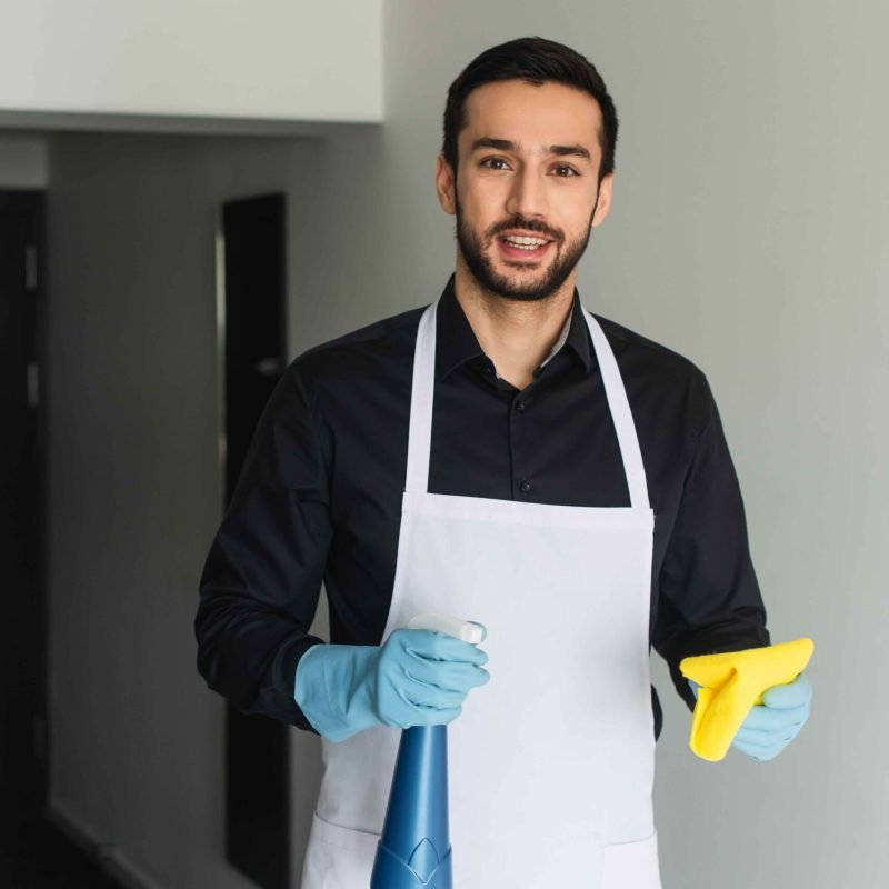 cheerful-and-bearded-housekeeper-in-blue-rubber-gl-2023-11-27-05-01-13-utc